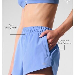 : Alo Dolphin shorts Color: Crystal Clear Blue
Size: M
